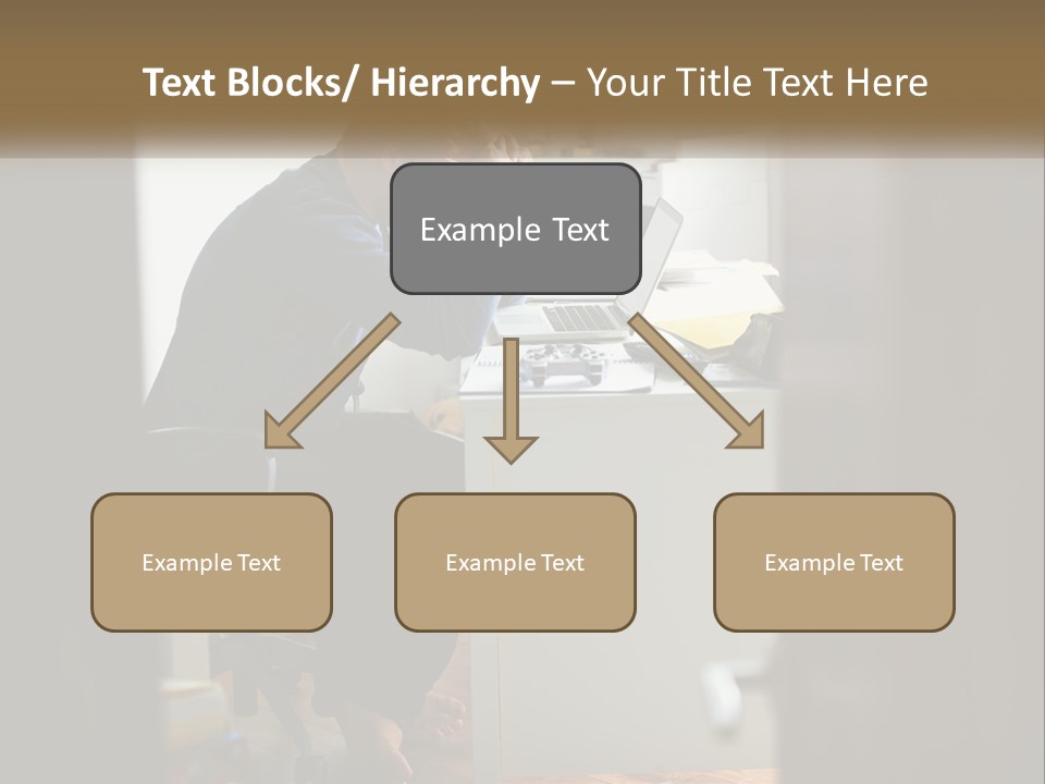A Man Sitting At A Desk In Front Of A Laptop Computer PowerPoint Template