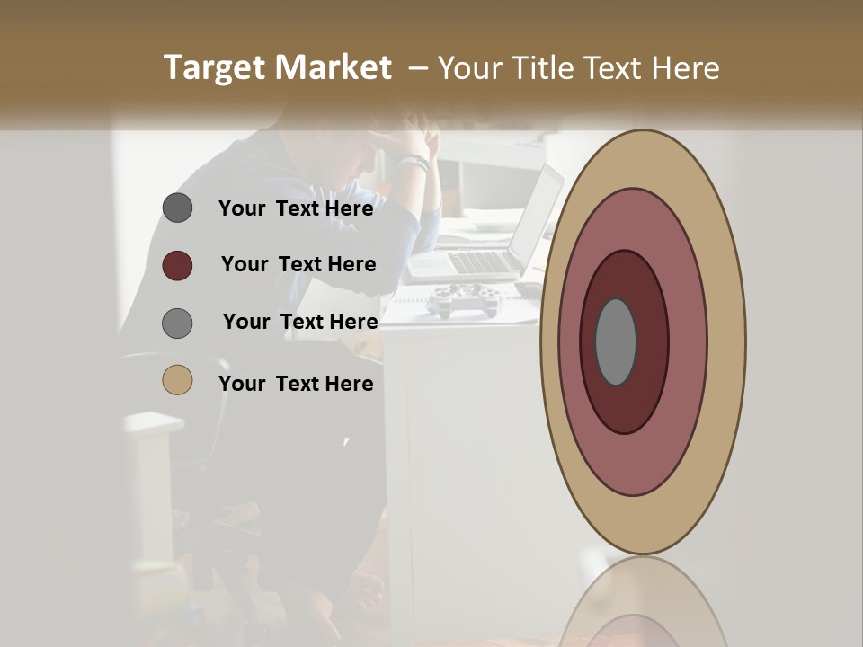 A Man Sitting At A Desk In Front Of A Laptop Computer PowerPoint Template