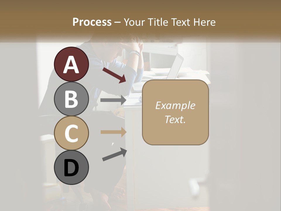 A Man Sitting At A Desk In Front Of A Laptop Computer PowerPoint Template