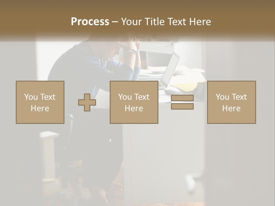 A Man Sitting At A Desk In Front Of A Laptop Computer PowerPoint Template
