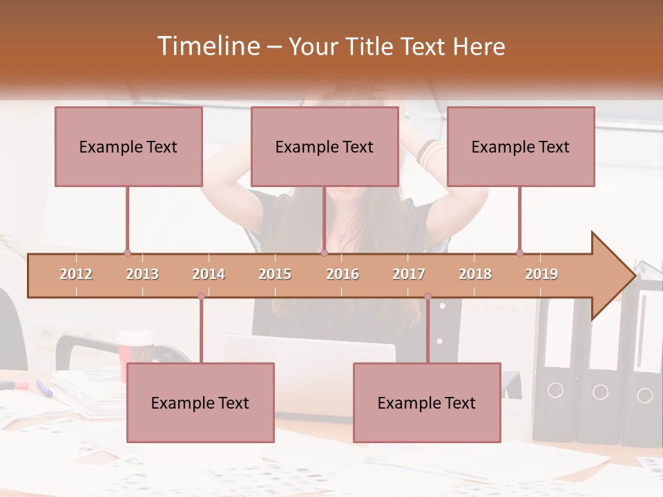 A Woman Sitting At A Desk With A Laptop PowerPoint Template