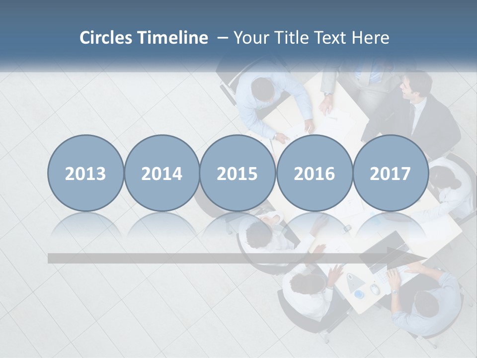 A Group Of People Sitting Around A Table PowerPoint Template