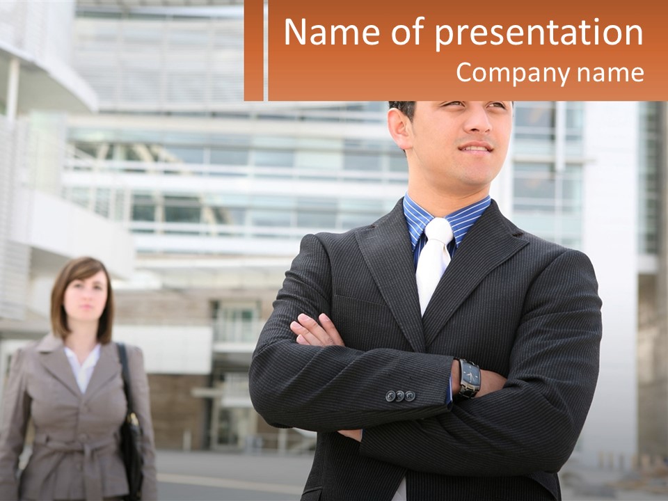 A Man In A Suit Standing With His Arms Crossed PowerPoint Template