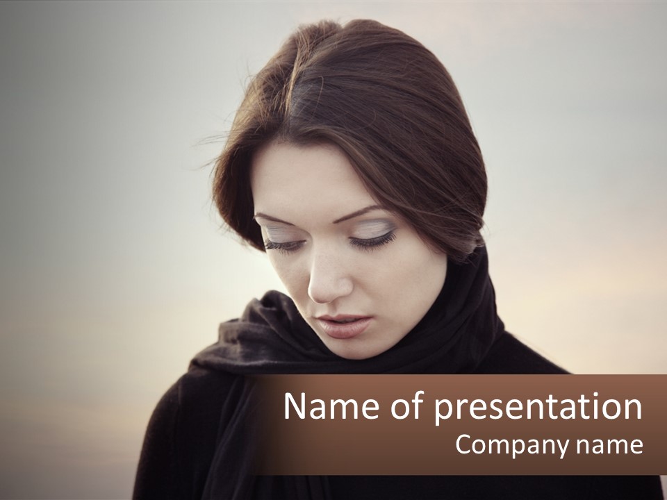A Woman In A Black Scarf Is Looking Down At Her Cell Phone PowerPoint Template