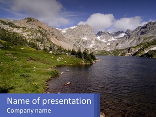 A Large Body Of Water Surrounded By Mountains PowerPoint Template