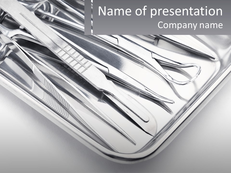 A Silver Tray Filled With Silverware On Top Of A Table PowerPoint Template