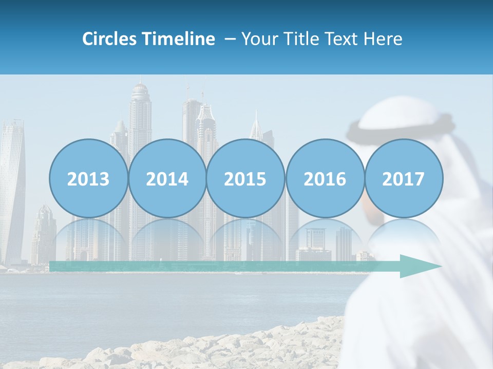 A Man Standing In Front Of A Body Of Water With A City In The Background PowerPoint Template