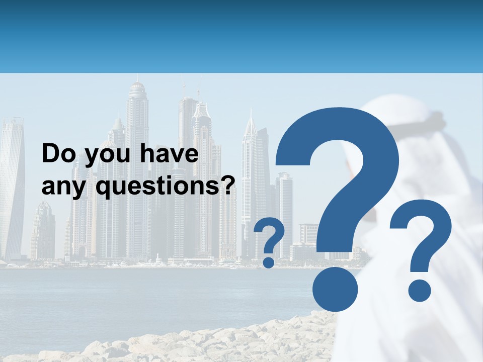 A Man Standing In Front Of A Body Of Water With A City In The Background PowerPoint Template