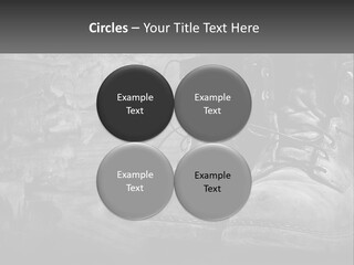 A Black And White Photo Of A Pair Of Boots PowerPoint Template