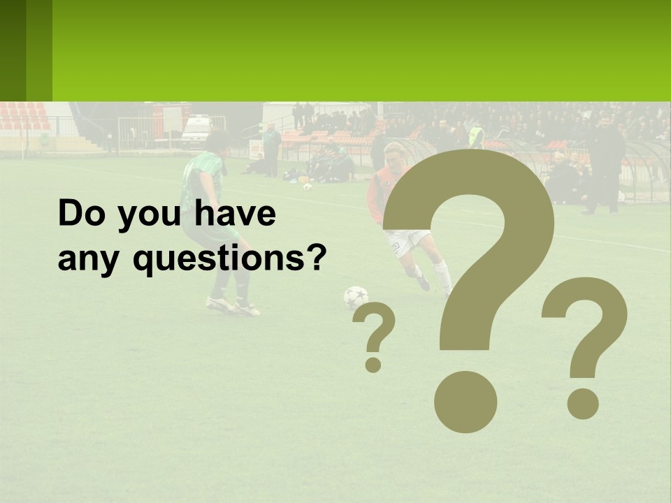 A Group Of Young Men Playing A Game Of Soccer PowerPoint Template