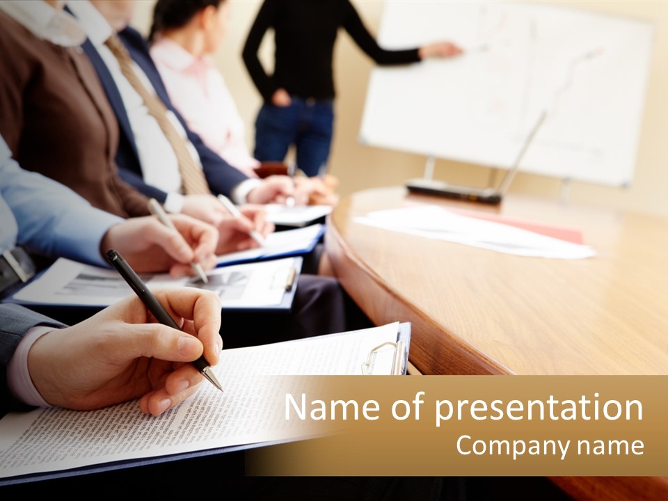 A Group Of People Sitting At A Conference Table PowerPoint Template