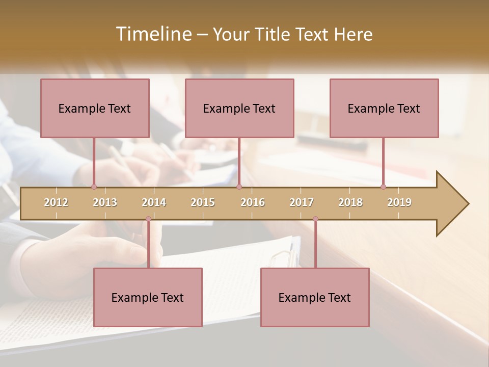 A Group Of People Sitting At A Conference Table PowerPoint Template