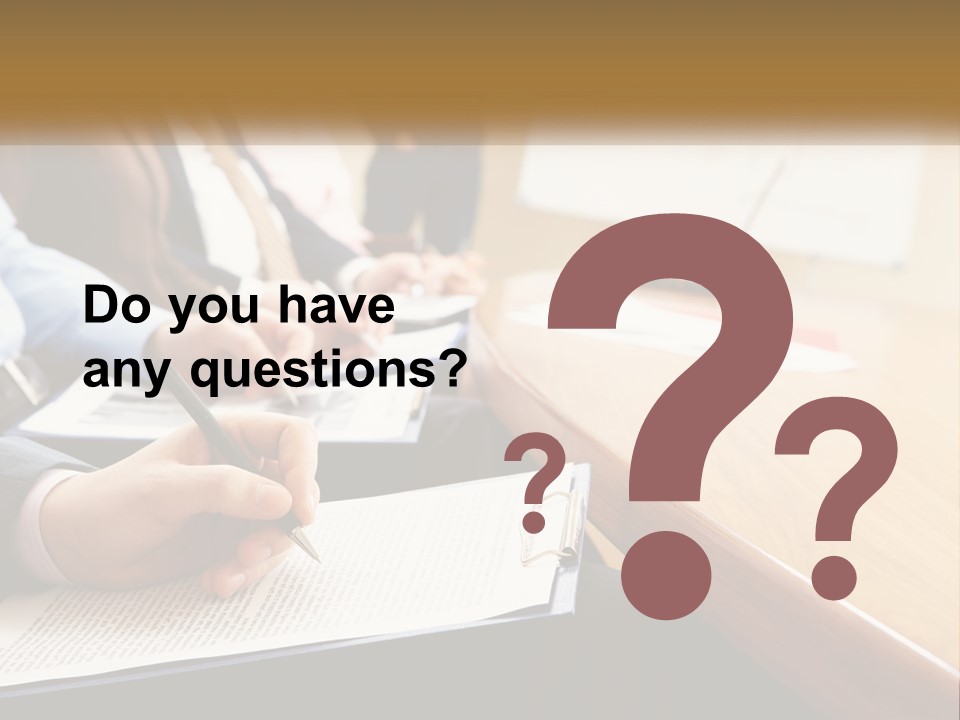 A Group Of People Sitting At A Conference Table PowerPoint Template