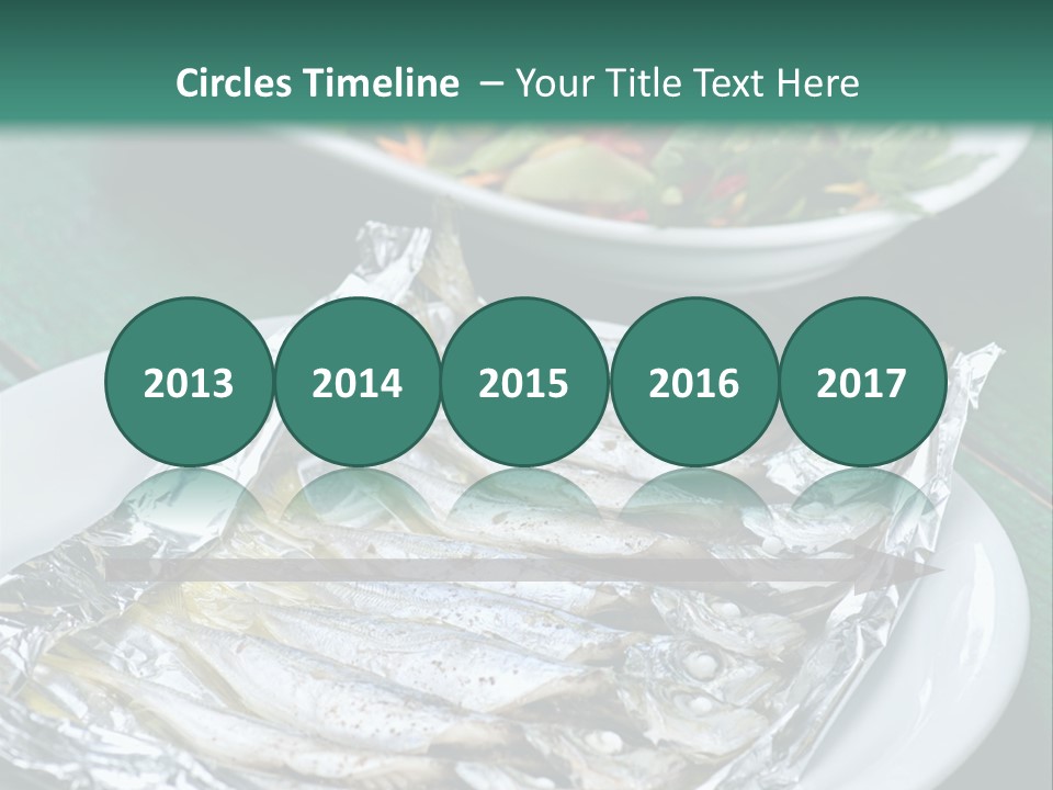 A Plate Of Fish Next To A Bowl Of Salad PowerPoint Template