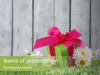 A Present Box With A Pink Ribbon And Daisies On The Grass PowerPoint Template