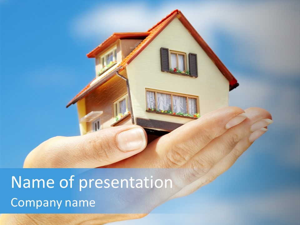 A Person Holding A Small Model House In Their Hand PowerPoint Template