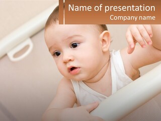 A Baby In A Crib With A Name Of Presentation PowerPoint Template