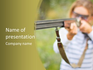 A Woman Holding A Rifle And Aiming It At The Camera PowerPoint Template