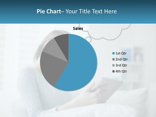 A Woman Sitting On A Couch Looking At A Tablet PowerPoint Template