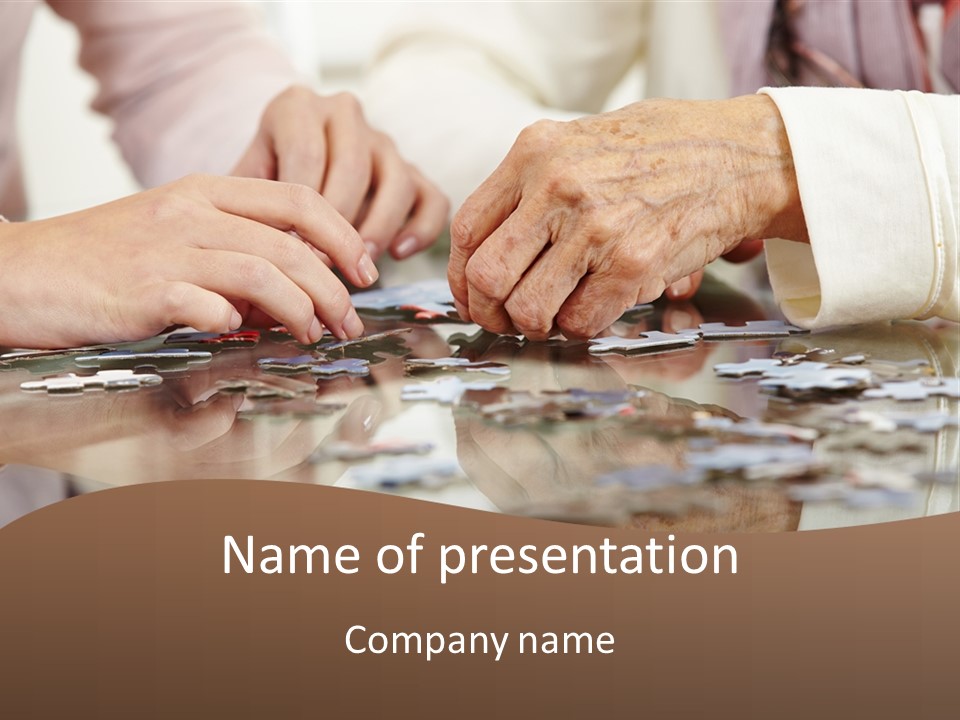 A Group Of People Holding Hands Over A Puzzle PowerPoint Template