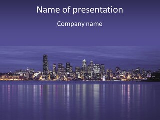 A City At Night With The Lights On Is Reflected In The Water PowerPoint Template