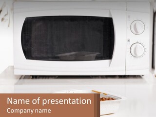 A White Microwave Oven Sitting On Top Of A Counter PowerPoint Template