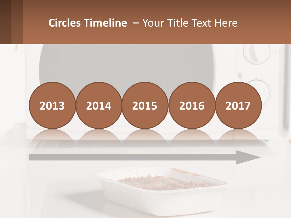 A White Microwave Oven Sitting On Top Of A Counter PowerPoint Template