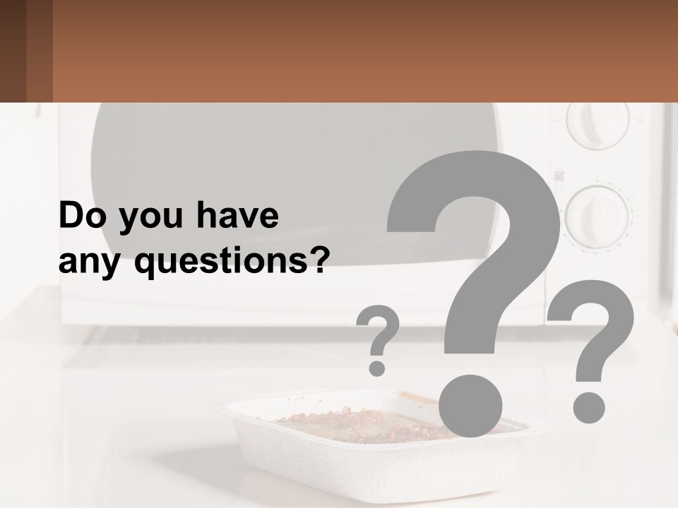 A White Microwave Oven Sitting On Top Of A Counter PowerPoint Template