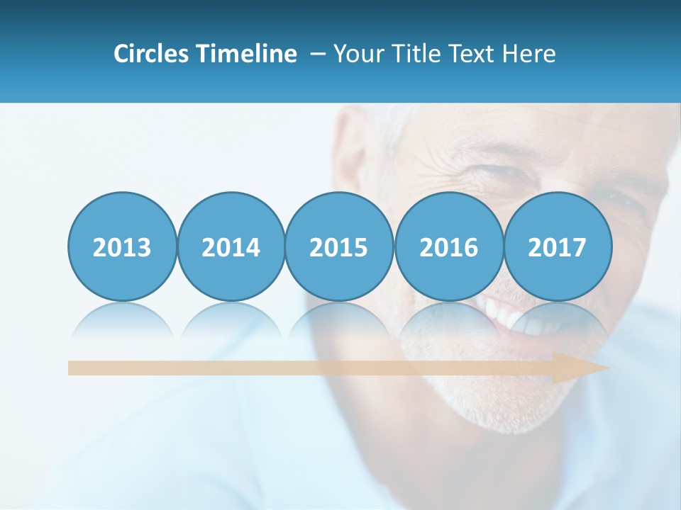A Close Up Of A Smiling Man With A Blue Shirt PowerPoint Template