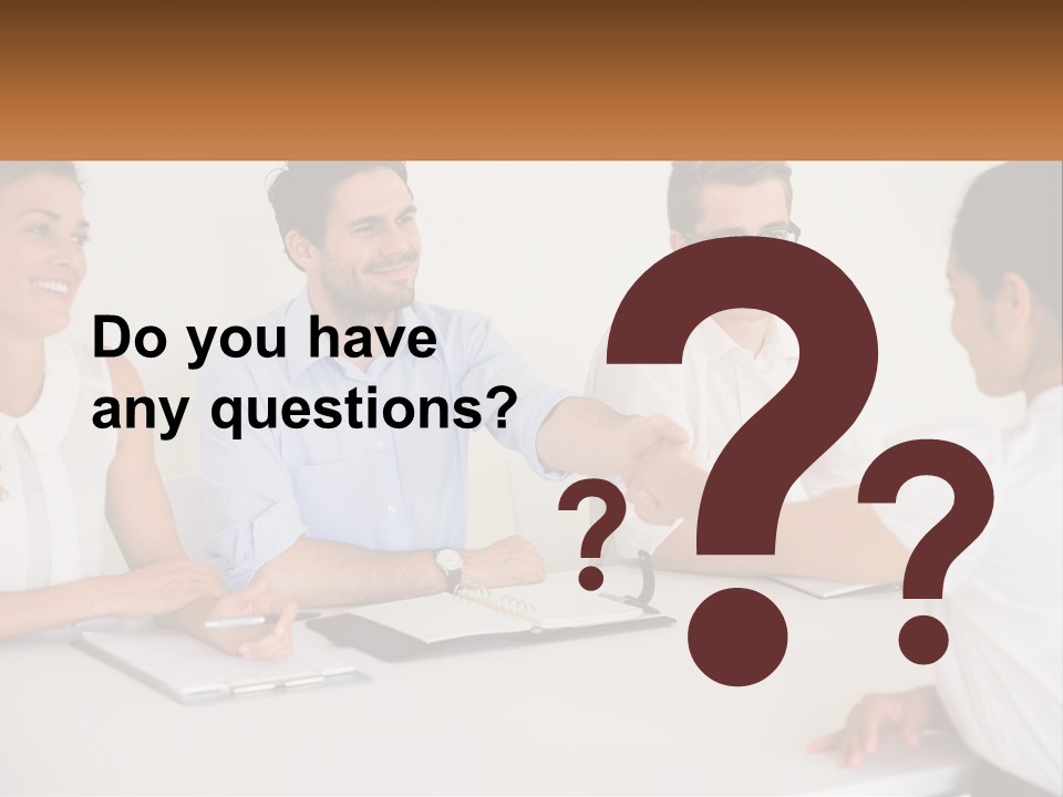 A Group Of People Sitting Around A Table Shaking Hands PowerPoint Template