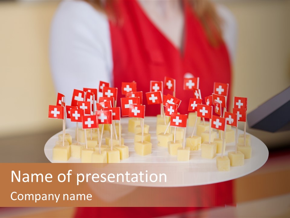 A Woman Holding A Tray Of Cheese With Swiss Flags On It PowerPoint Template