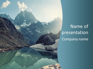 A Mountain Lake Surrounded By Snow Covered Mountains PowerPoint Template