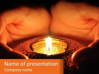 A Person Holding A Lit Candle In Their Hands PowerPoint Template