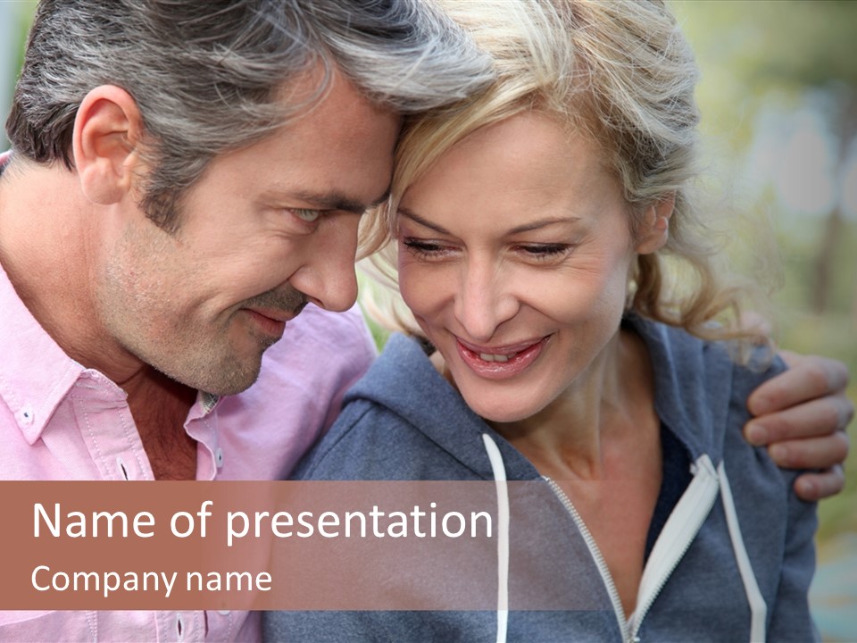 A Man And A Woman Looking At A Cell Phone PowerPoint Template