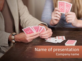 A Man And Woman Playing Cards On A Table PowerPoint Template