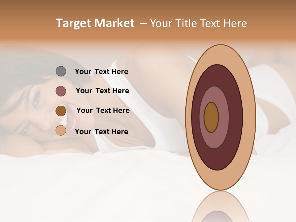 A Woman Laying On A Bed Smiling For The Camera PowerPoint Template