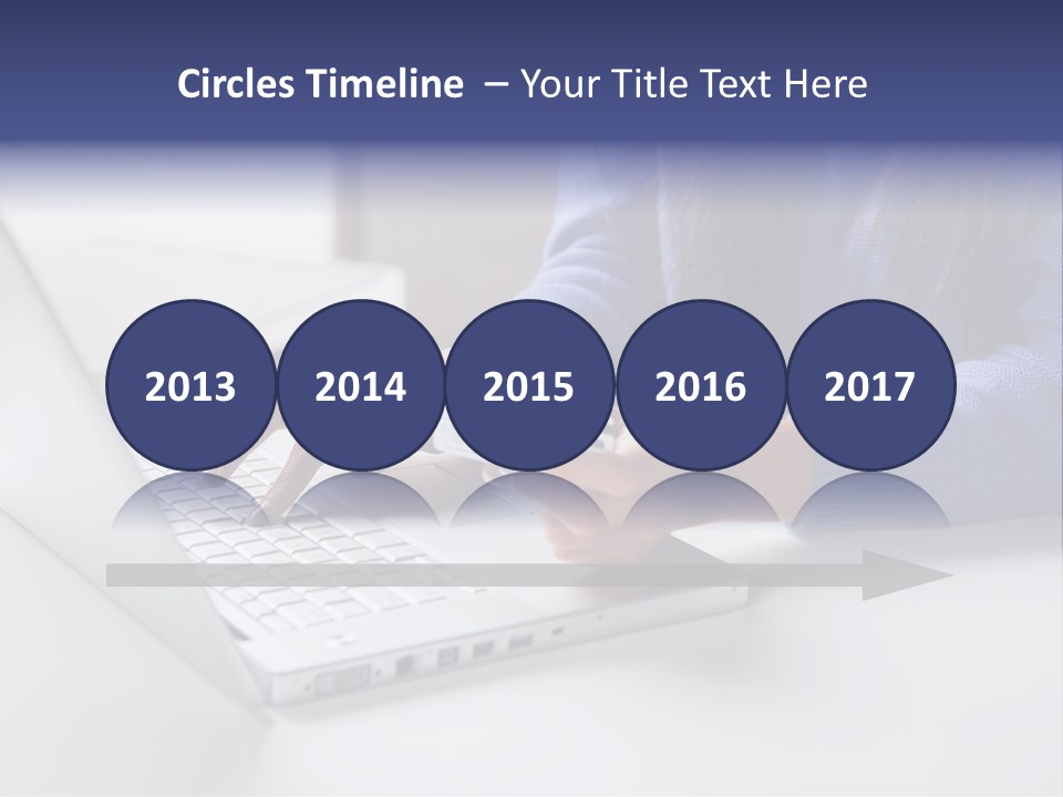 A Woman Holding A Credit Card While Using A Laptop PowerPoint Template