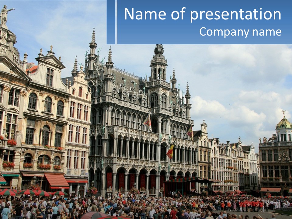 A Large Group Of People Standing In Front Of A Building PowerPoint Template