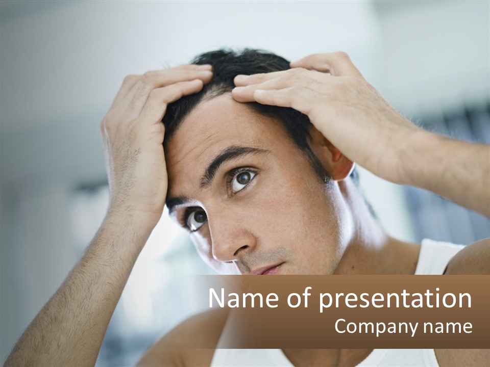 A Man Holding His Hair In Front Of His Head PowerPoint Template