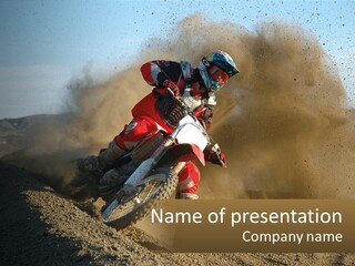 A Person Riding A Dirt Bike On A Dirt Track PowerPoint Template