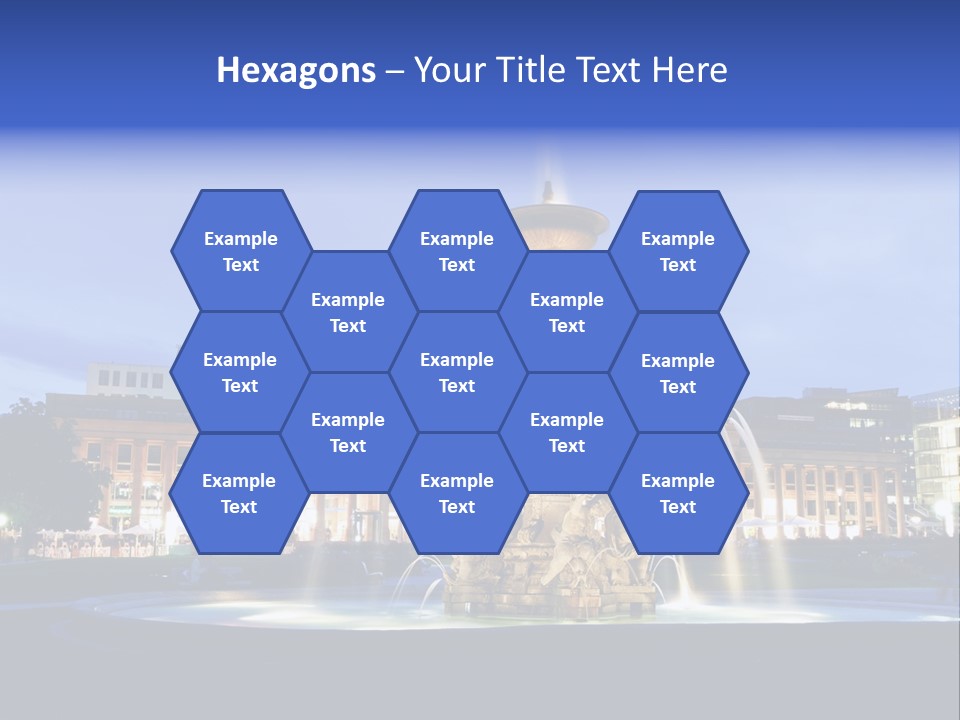 A Fountain In Front Of A Building At Night PowerPoint Template