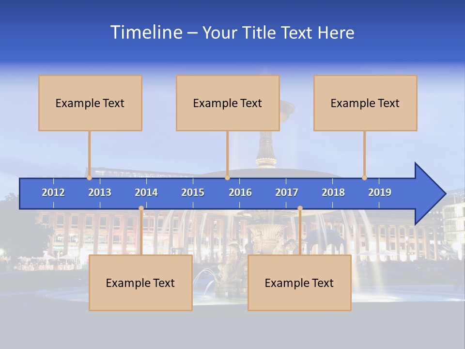 A Fountain In Front Of A Building At Night PowerPoint Template