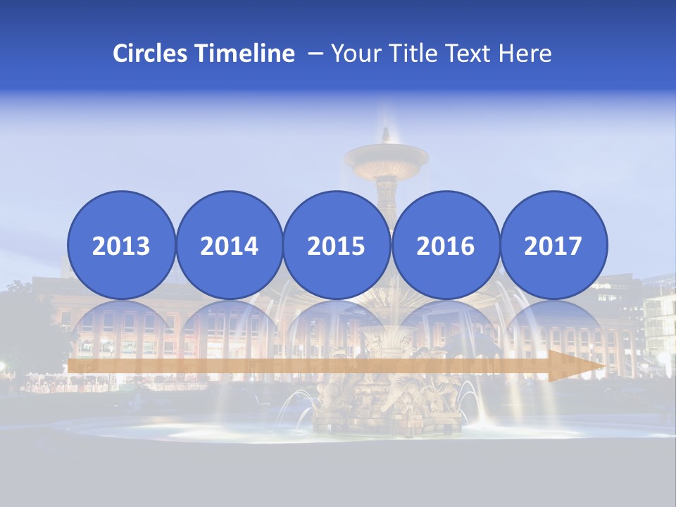 A Fountain In Front Of A Building At Night PowerPoint Template