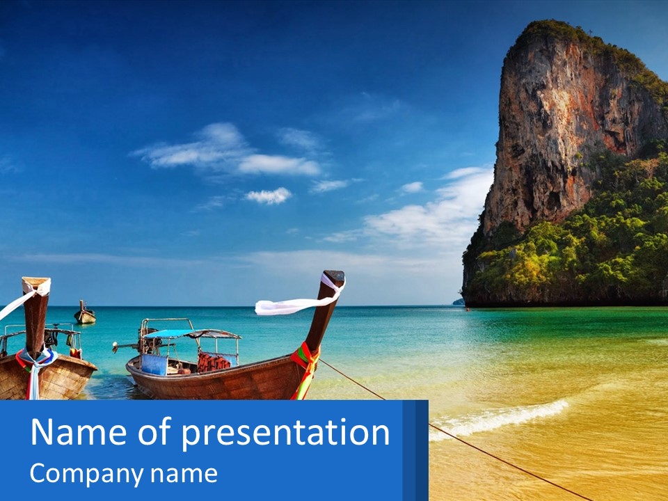 Two Boats On The Beach With A Mountain In The Background PowerPoint Template