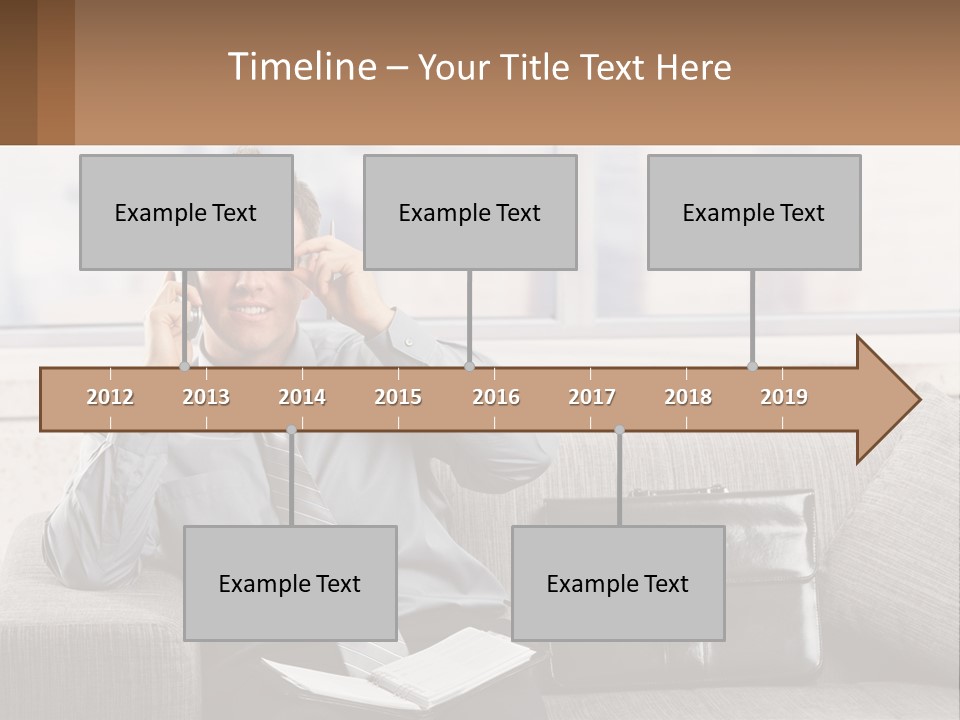 A Man Sitting On A Couch Talking On A Cell Phone PowerPoint Template