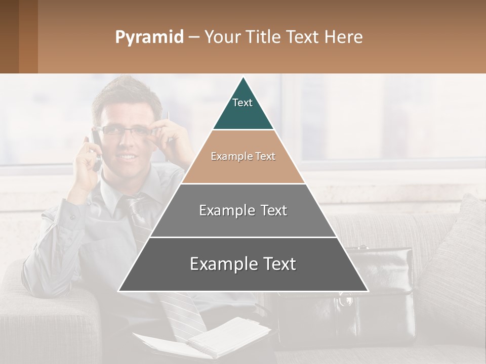 A Man Sitting On A Couch Talking On A Cell Phone PowerPoint Template