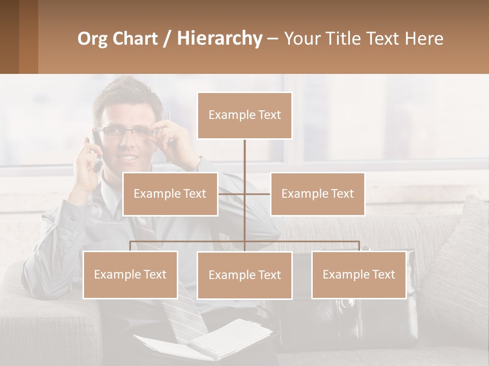 A Man Sitting On A Couch Talking On A Cell Phone PowerPoint Template