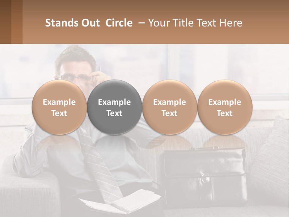 A Man Sitting On A Couch Talking On A Cell Phone PowerPoint Template