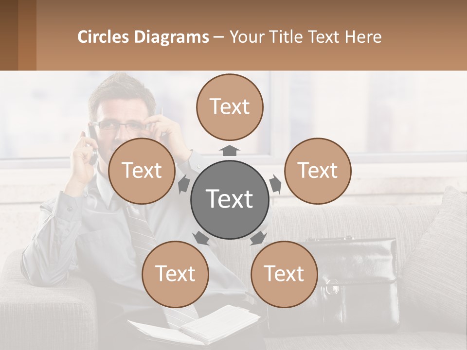 A Man Sitting On A Couch Talking On A Cell Phone PowerPoint Template