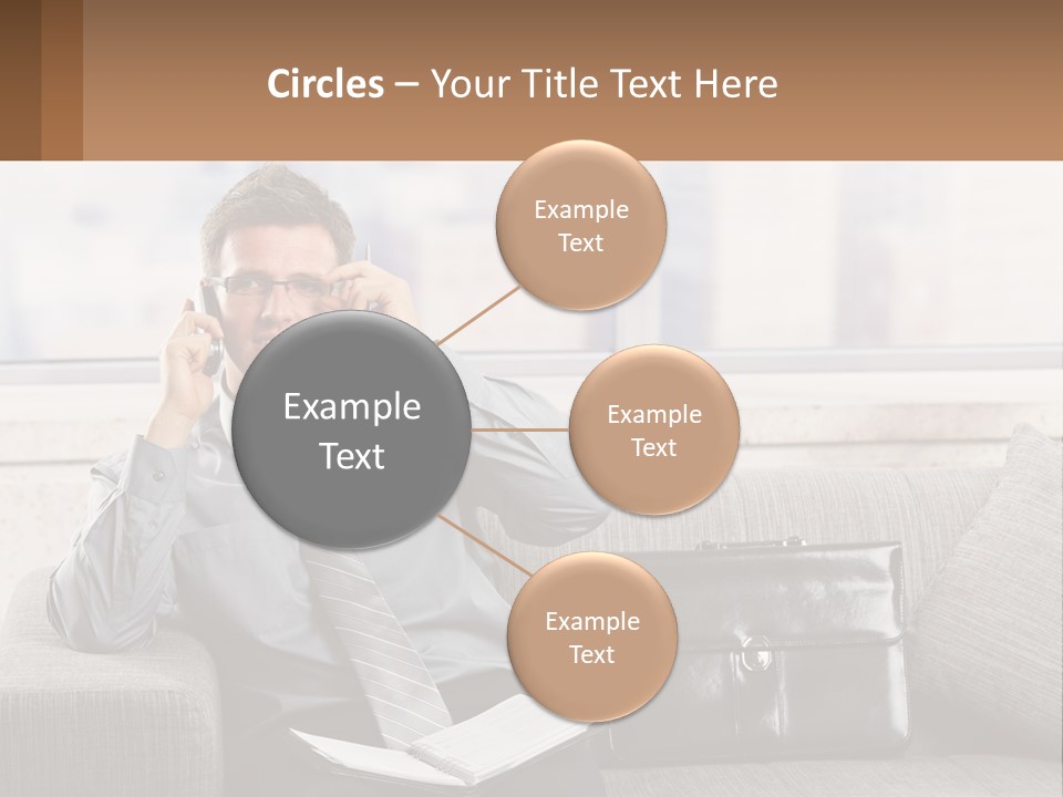 A Man Sitting On A Couch Talking On A Cell Phone PowerPoint Template